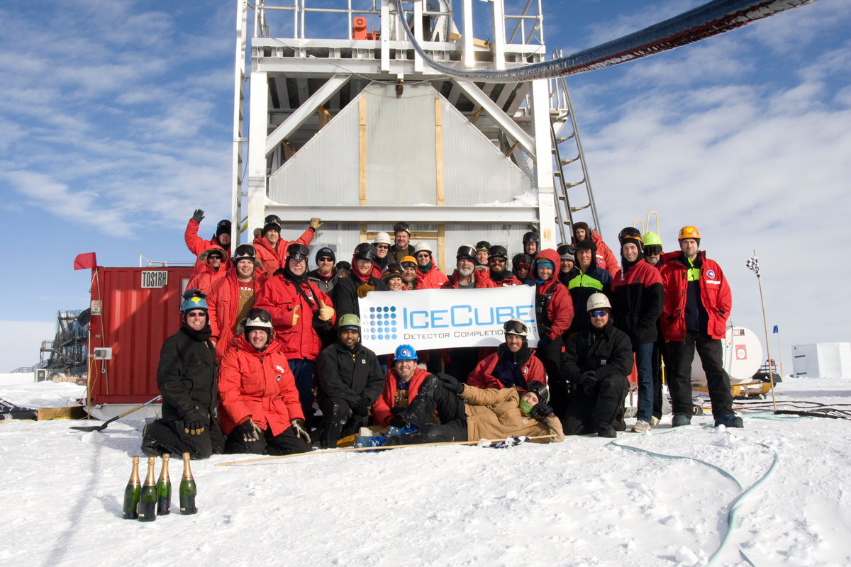 The IceCube team celebrates the successful completion of the IceCube Neutrino Observatory in front of the deployment tower on December 18, 2010. Credit: Chad Carpenter, IceCube/NSF